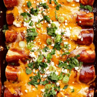Cozy black bean enchiladas topped with cheese and served with salsa