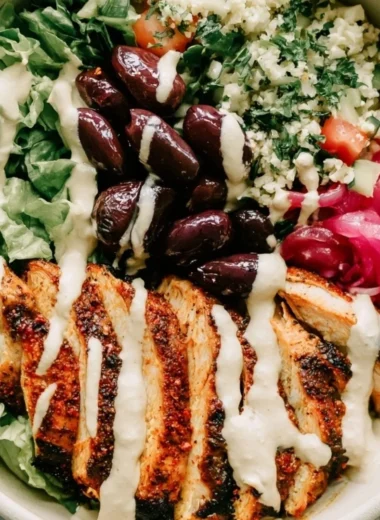 Cozy chicken shawarma meal prep bowls with fresh ingredients and spices.