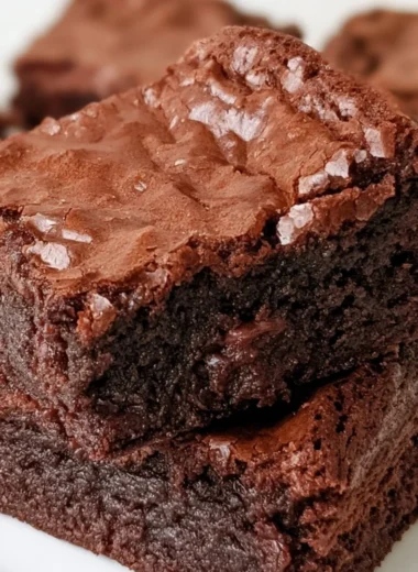 Delicious homemade brownies topped with chocolate drizzle.