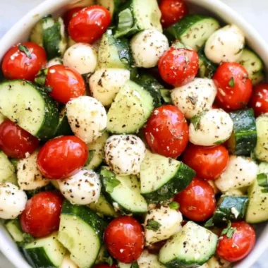 Fresh Cucumber Caprese salad with tomatoes and mozzarella cheese