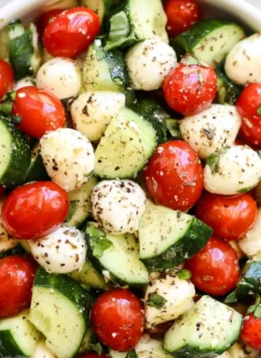 Fresh Cucumber Caprese salad with tomatoes and mozzarella cheese