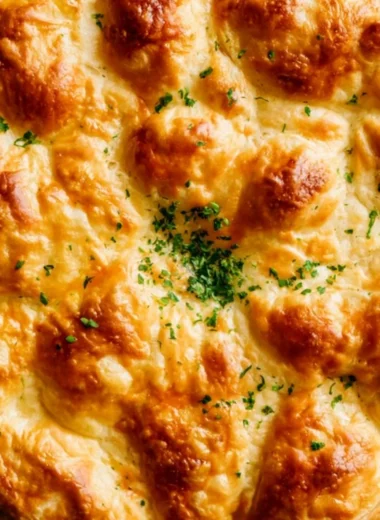 Delicious Dutch Oven Chicken Pot Pie with flaky crust and savory filling