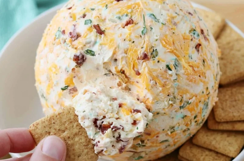 Easy cheese ball served with crackers and veggies on a platter