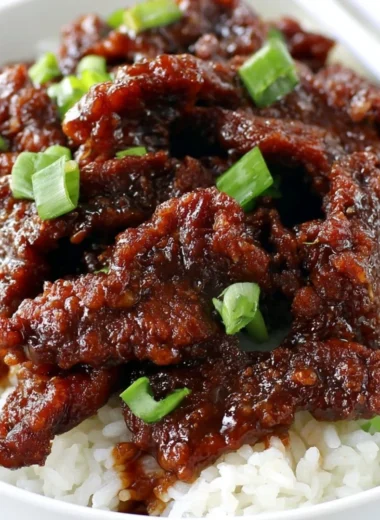 Delicious gluten-free Mongolian Beef served with rice and vegetables.