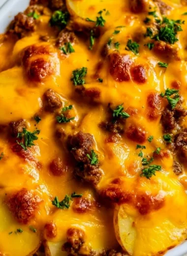 Delicious Hobo Casserole with ground beef, veggies, and cheese baked to perfection.