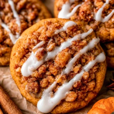 Delicious Pumpkin Coffee Cake Cookies topped with spices and icing.