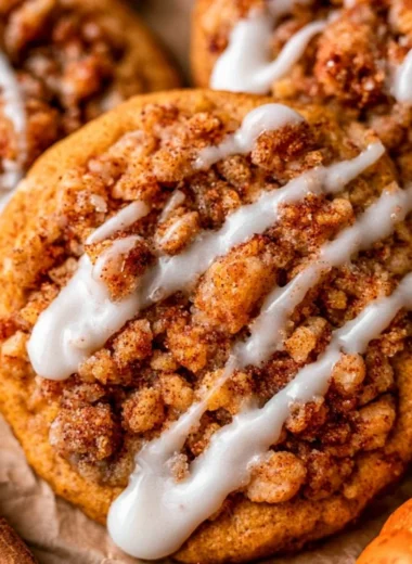 Delicious Pumpkin Coffee Cake Cookies topped with spices and icing.