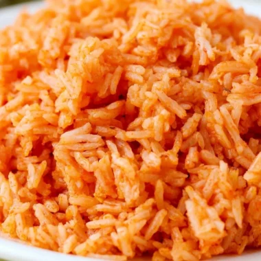 Plate of quick and easy Spanish rice with fresh herbs and spices.