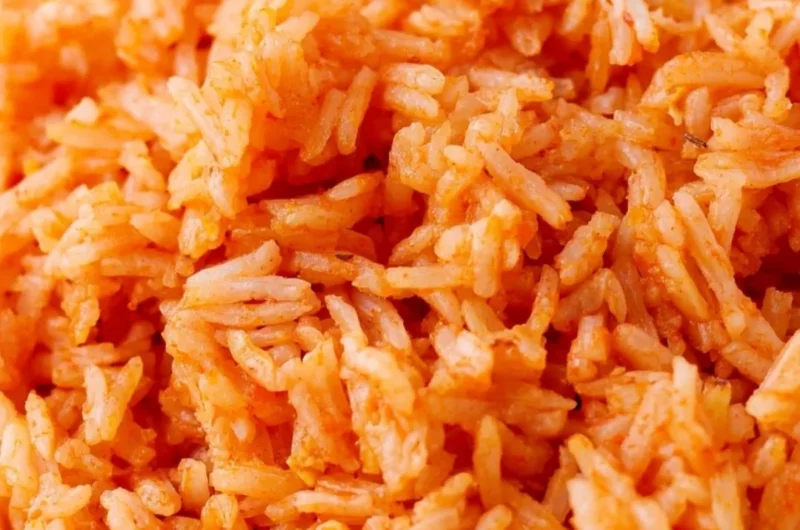 Plate of quick and easy Spanish rice with fresh herbs and spices.
