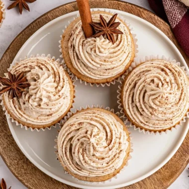 Delicious spiced chai latte cupcakes topped with creamy frosting on a plate.