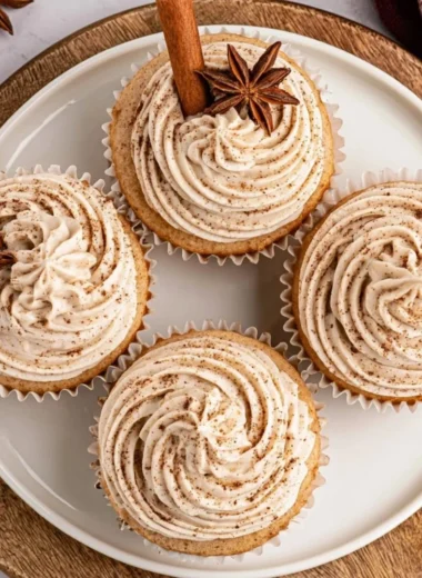 Delicious spiced chai latte cupcakes topped with creamy frosting on a plate.